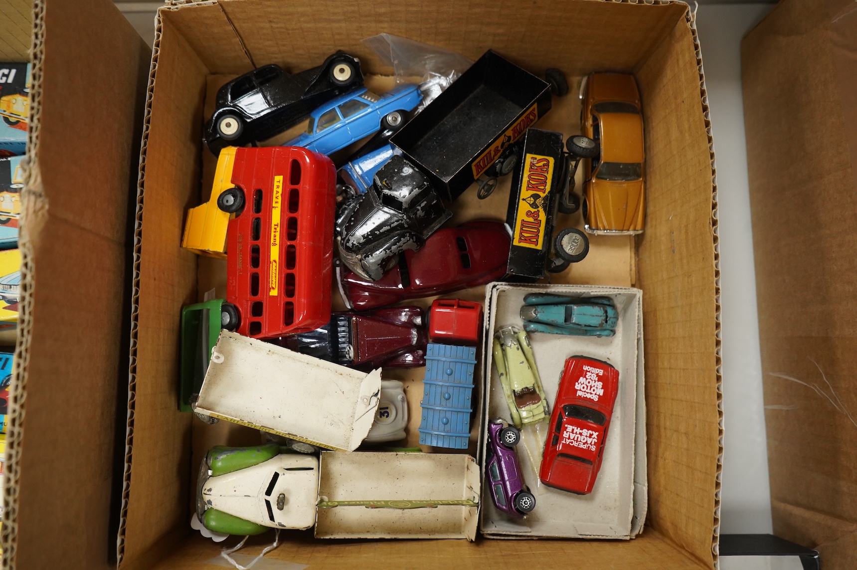 Twenty 1960s Corgi Toys, all playworn or restored examples in reproduction boxes, including cars, a milk float and two Land Rovers, etc., together with a quantity of additional diecast, etc. Vehicles by a variety of make